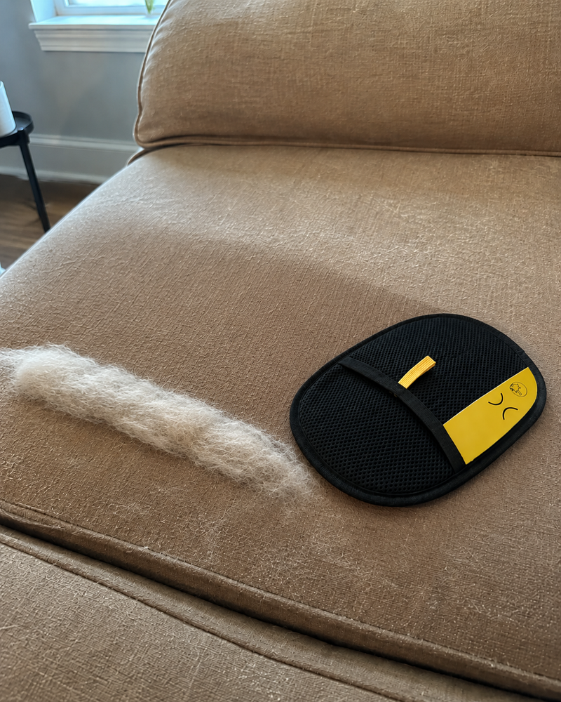 FurGlide Pro pulling embedded fur out of a couch
